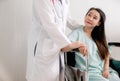 Hands woman doctor reassuring her female patient in hospital room,Doctor giving a consultation and encouragement to patient Royalty Free Stock Photo