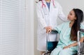 Hands woman doctor reassuring her female patient in hospital room,Doctor giving a consultation and encouragement to patient lookin Royalty Free Stock Photo