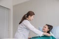 Hands woman doctor using blanket to her female patient in hospital room,Doctor giving a consultation and encouragement to patient Royalty Free Stock Photo