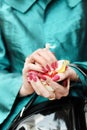 Hands of a woman full of rose petals Royalty Free Stock Photo