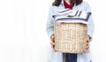 Hands Woman holding a Donate Box with full of Clothes.