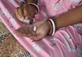 Hands of a woman holding pills and bottle. Woman taking medicine