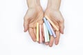 Hands of a woman holding some colored chalks Royalty Free Stock Photo
