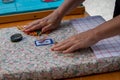 Hands of woman making bobbin lace. Colorful lace threads Royalty Free Stock Photo