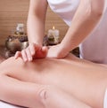 Hands of a woman making massage on a womans back Royalty Free Stock Photo