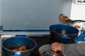 Hands of woman making some meat on a cooking pot