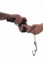 Hands of woman and man with gun and handcuffs Royalty Free Stock Photo