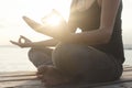 Hands of woman meditating on a yoga pose on the beach Royalty Free Stock Photo