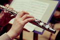 Hands of a woman playing a flute Royalty Free Stock Photo