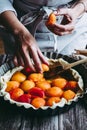 Hands of a woman preparing an apricot pie Royalty Free Stock Photo