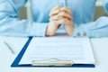 Woman`s hands preparing to sign the contract document with pen on desk. selective focus image on sign a contract. Royalty Free Stock Photo