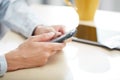 Hands of woman sending SMS via smartphone at lunch Royalty Free Stock Photo