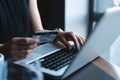 Hands of Woman shopping in Internet, making instant Payment Transaction at Computer, using Credit Card.