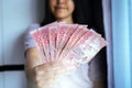 Hands woman show Thai money banknotes Royalty Free Stock Photo