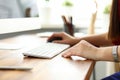 Hands of woman working on computer with mouse in office Royalty Free Stock Photo