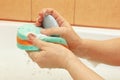 Hands of woman soaping green sponge with soap Royalty Free Stock Photo