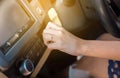 Hand woman turning on car air conditioning system,Finger turns on air button Royalty Free Stock Photo