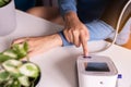 Hands woman using blood pressure & heart rate monitors in yourself at home Royalty Free Stock Photo