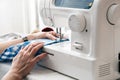 Hands of a woman using a sewing machine Royalty Free Stock Photo