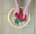 The hands of a woman wash things by hand Royalty Free Stock Photo