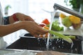 Hands woman washing vegetables. Preparation of fresh salad. Royalty Free Stock Photo