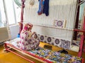 Hands of a woman are weaving carpet tools and threads handmade in Uzbekistan Samarkand Bukhara carpet, textile production folk