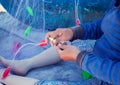 Hands woman weaving fishing nets Royalty Free Stock Photo