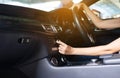 Hands woman driver turning on car air condition system,Button on dashboard in modern car panel,Auto car air conditioner Royalty Free Stock Photo