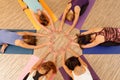 Hands of the women forming circle/Vinyasa flow yoga