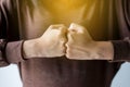 Hands of woman show strength teamwork,Fist bump and putting her hand