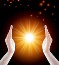 The hands of women who respect and pray on the background of colored particles, the light of the sun or the light of hope. Royalty Free Stock Photo