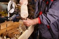 Hands woodcarver while working with the tools