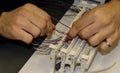 Hands at work in network cabling practice in an information technology classroom Royalty Free Stock Photo