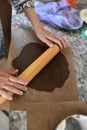 Mom rolls dough. chocolate dough. Hands working with dough preparation recipe bread. Female hands making dough for pizza. Woman`s Royalty Free Stock Photo