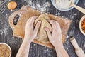 Hands working with dough preparation recipe bread, pizza or pie making ingridients, food flat lay on kitchen table background Royalty Free Stock Photo