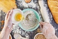 Hands working with dough preparation recipe bread, pizza or pie making ingridients, food flat lay on kitchen table background Royalty Free Stock Photo