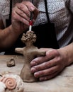 Hands working and finishing sculpture with clay Royalty Free Stock Photo