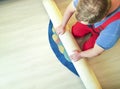 Hands working, folding work carpet on the floor of the house Royalty Free Stock Photo