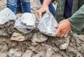 Hands working on masonry stone wall Royalty Free Stock Photo