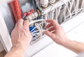 Maintenance of Plumbing System With Hands Adjusting Valve and Pipes Royalty Free Stock Photo