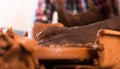 Hands working on pottery wheel Royalty Free Stock Photo