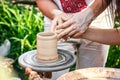 Hands working on pottery wheel. Sculptor, Potter. Human Hands creating a new ceramic pot. Royalty Free Stock Photo