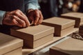 Hands working in a sustainable packaging workshop using eco-friendly methods Royalty Free Stock Photo