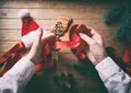 Hands wrapping christmas golden key and gifts Royalty Free Stock Photo