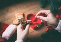 Hands wrapping christmas golden key and gifts Royalty Free Stock Photo