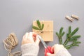 Hands are wrapping a gift from natural materials Royalty Free Stock Photo