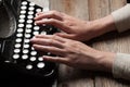 Hands writing on old typewriter over wooden table Royalty Free Stock Photo