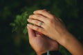 Hands of a young couple with a ring. close up of man giving diamond ring to woman Royalty Free Stock Photo