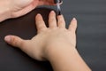 The hands of a young girl make a manicure with shellac coating