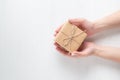 Hands of a young girl opening a gift box on a white background Royalty Free Stock Photo